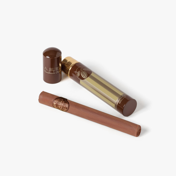 Father's Day Chocolate cigar. Velvety smooth dark chocolate rum ganache is hand-rolled into the shape of a cigar then hand-dipped in milk chocolate.
